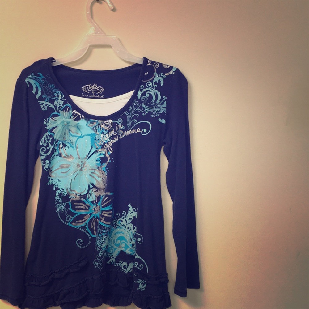 This is a long sleeve blue shirt with a sting
